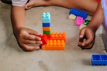 Fotobehang Lego child playing with blocks  © and