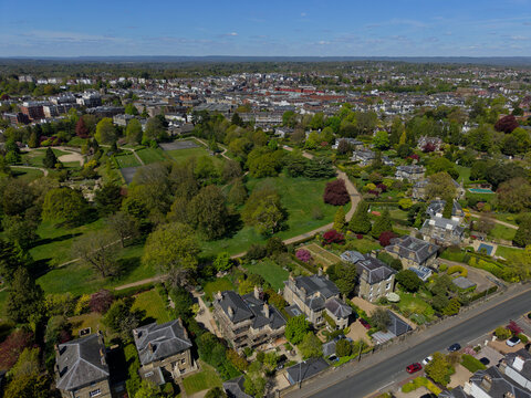 Royal Tunbridge Wells wealthy residential area on the top of the hill with beautiful park and gardens. Aerial view towards Calverley Park and town center. Green landscape and colorful gardens in Kent,