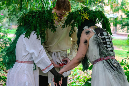  Rusalka in white with a wreath on her head and green hair