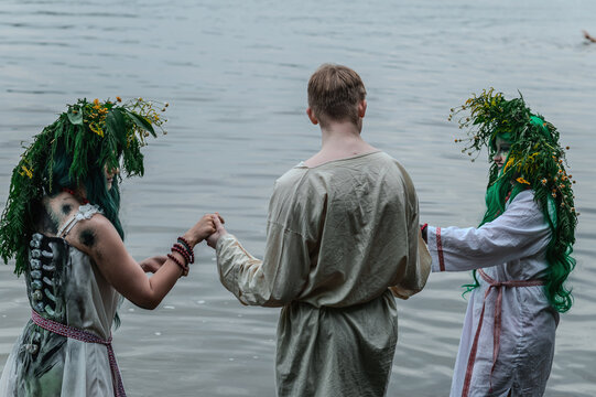 Rusalka in white with a wreath on her head and green hair