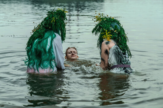  Rusalka in white with a wreath on her head and green hair