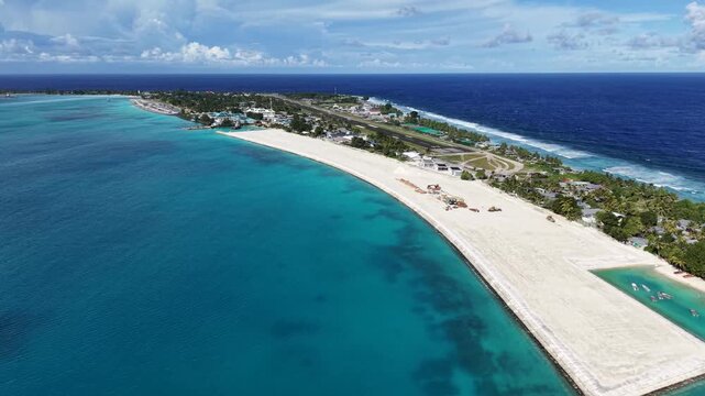 Aerial of Funafuti, Tuvalu: Drone flying north over lagoon along runway and TCAP_A reclamation area (March 2026)