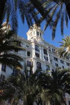 Casa Carbonell in Alicante, Spain, surrounded by green palm trees