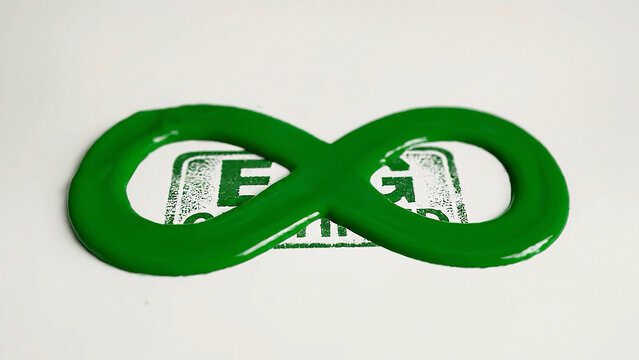Glossy green infinity loop with faded ESG stamp on white