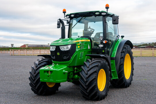A green John Deere 6125R agricultural tractor parked outdoors, Northern Ireland, UK.