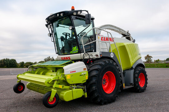 A Claas Jaguar 960 forage harvester sitting on a large farm yard