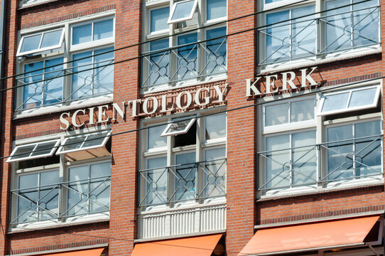 Exterior view of the Scientology church building located Wibautstraat 112 Amsterdam, Netherlands, featuring traditional Dutch architecture and signage.