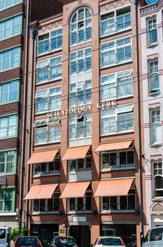 Exterior view of the Scientology church building located Wibautstraat 112 Amsterdam, Netherlands, featuring traditional Dutch architecture and signage. 