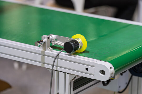 Close up of encoder testing device on factory production line