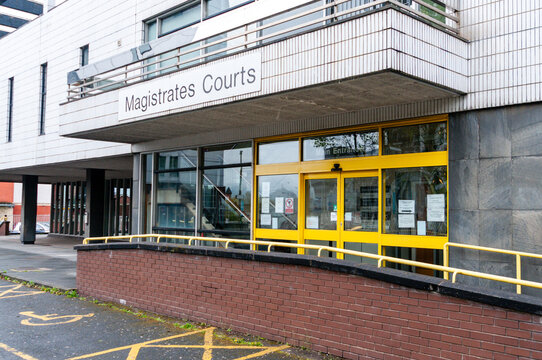 Exterior of Preston Magistrates Court, a prominent historic stone building in Lancashire featuring classical architecture, grand entrance steps, and a formal legal facade during a clear day