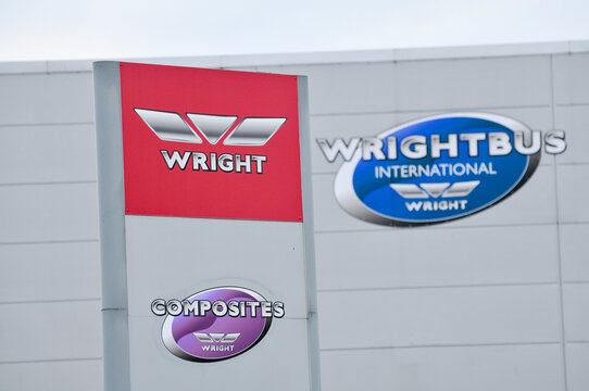 Signage and corporate branding outside the Wrightbus manufacturing headquarters in Ballymena, Northern Ireland, a global leader in zero-emission bus technology