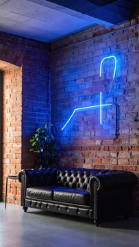 Interior scene. Black leather couch, exposed brick wall with neon figure, plant
