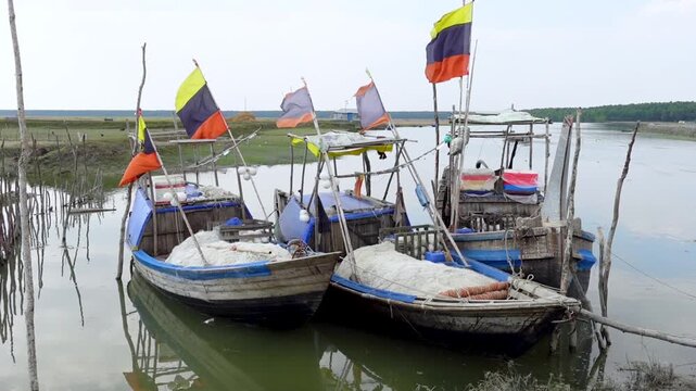 Some wooden fishing boats waiting at Char Kukri Mukri Island also union, at Bhola District.