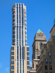 Obraz premium Majestic modern New York skyscrapers reflecting sunlight across iconic Manhattan skyline with towering architecture, urban atmosphere, and vibrant city energy, travel Usa