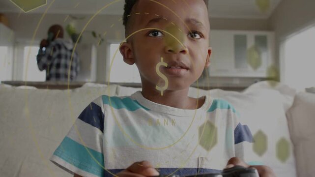 Boy pressing controller on couch, scoring rewards, gaming HUD $ icon growing, boy standing cheering