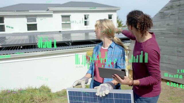 Male tech pointing with tablet urging woman holding panel as green overlay marking solar for setup
