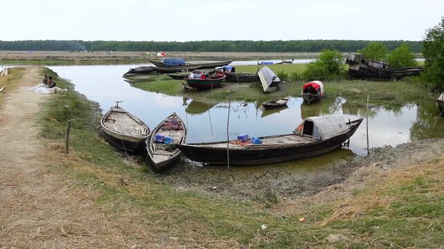 Some wooden fishing boats waiting at Char Kukri Mukri Island also union, at Bhola District.