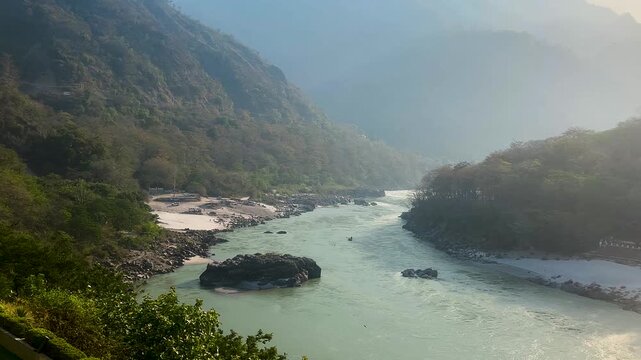 Scenic View of the Ganga River Flowing Through Rishikesh, India, Peaceful Ganga River and Himalayan Landscape in Rishikesh Uttarakhand