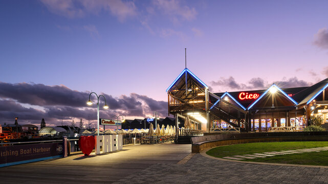 Perth, Western Australia, Australia - April 23 2026: Fremantle Fishing Boat Harbour at twilight. Tourism destination, well known Fish and Chips restaurant Cicerello's. Colorful, neon light signs. Love