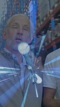 Vertical video: Lead scanning warehouse racks causing blue effect tech raising phone showing stock