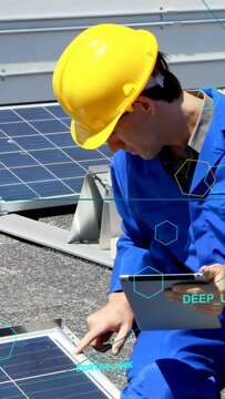 Vertical video: Solar tech tapping tablet and pointing at panel, calling HUD hexagons for check