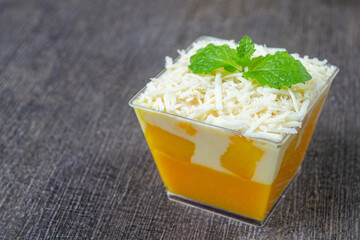 puding salad mangga, mango salad pudding with creamy dressing and cheese in clear cups © Muhammad Senopati