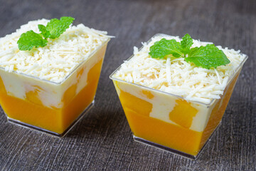 puding salad mangga, mango salad pudding with creamy dressing and cheese in clear cups © Muhammad Senopati