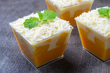puding salad mangga, mango salad pudding with creamy dressing and cheese in clear cups © Muhammad Senopati