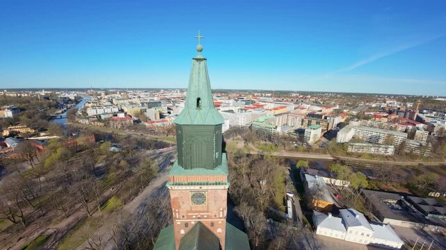 Aerial 4K: Ascending next to Turku Cathedral Tower with City Panorama Reveal