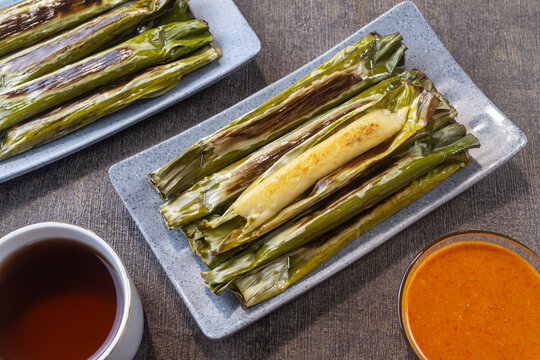 Otak-otak indonesian snack, made from minced fish meat mixed with tapioca or sago flour, coconut milk and spices, then wrapped in banana leaves and grilled
