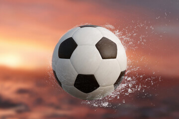 Fototapeta premium Soccer ball water splash floating sunset outdoor motion dynamic sport wet competition dramatic energy action summer recreation excitement sky evening play leisure athletic goal winning active