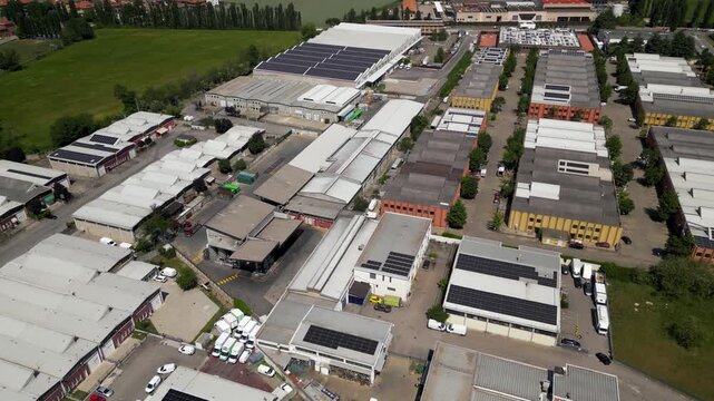 Aerial View of an Industrial Park: An expansive aerial photograph showcases a bustling industrial park filled with numerous warehouses, factories, and office buildings.