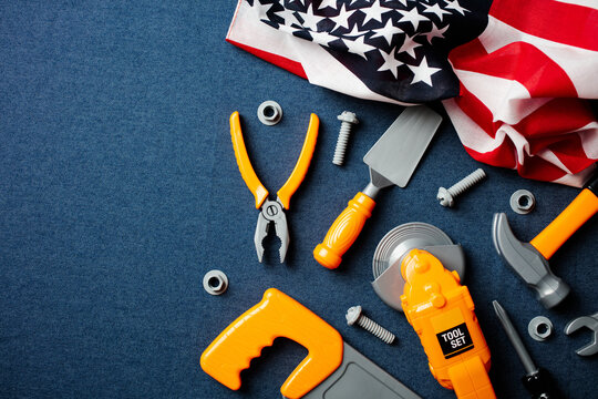 Toy construction tools and American flag for Labor Day concept