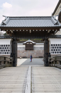 Woman framed in Hashizume Gate of Kanazawa Castle in Kanazawa, Japan