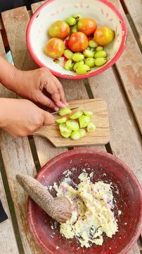 Traditional Indonesian sambal preparation process with local ingredients