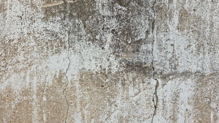 Fototapeta premium Weathered and Cracked Concrete Wall Texture with Gritty Stained Surface and Distressed Gray Cement Finish 