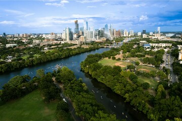 Austin Skyline Over Lady Bird Lake with Lush Green Parks, Kayakers on the Colorado River, and Modern Downtown Towers Under a Bright Texas Sky © Umm Hamzah