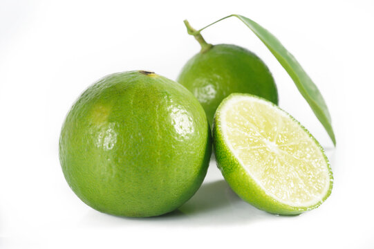 Fresh lime and leaf on white blackground