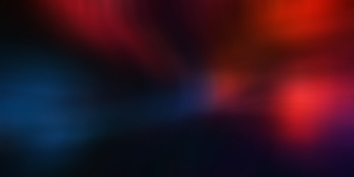 Abstract dark background with blurred red and blue light spots creating a mysterious and atmospheric visual effect.