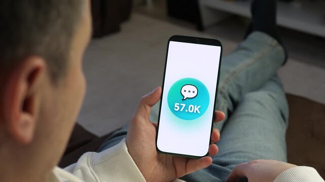 Watch viral growth in real-time. Social media comment counter skyrockets from 50K to 75K on a smartphone. Perfect for digital marketing, influencer success, and engagement analytics content. High