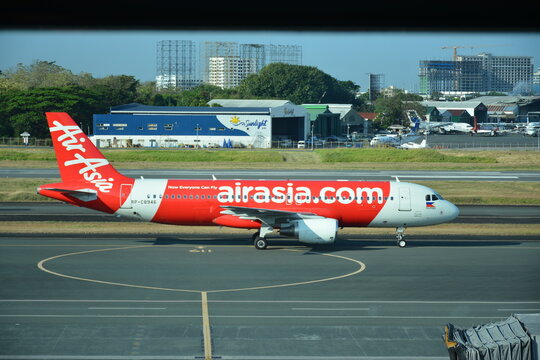 Air Asia plane for take off at Ninoy Aquino International Airport Terminal 3 in Pasay, Philippines