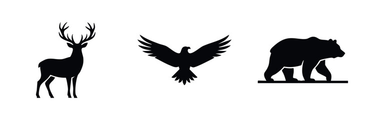 Fototapeta premium Minimalist black silhouettes of a deer with antlers, a flying eagle, and a walking bear isolated on a white background.
