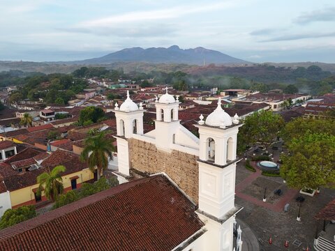 Aerial view of the town square in Suchitoto, El Salvador, featuring church, Parroquia de Santa Luc&iacute;a at the centre. Wide landscape captures colonial architecture, surrounding streets,.