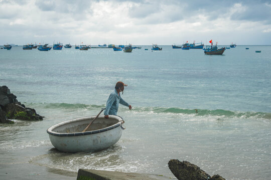 Fisherman Launching Basket Boat in Nha Trang
