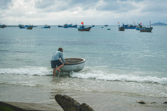Fisherman Launching Basket Boat in Nha Trang