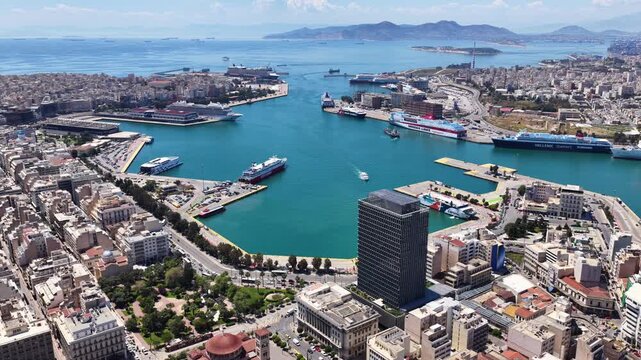 Pi Aerial drone cinematic video from famous busy port of Piraeus and new renovated landmark skyscraper Tower of Piraeus, Attica, Greece