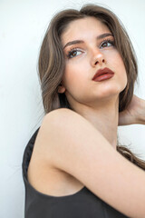 Obraz premium Studio portrait of a young beautiful brunette woman