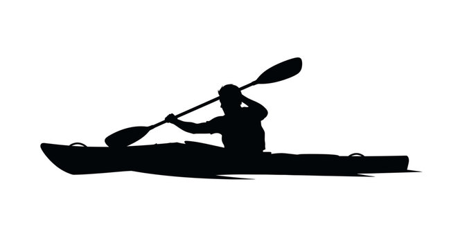 Black silhouette of kayaker paddling