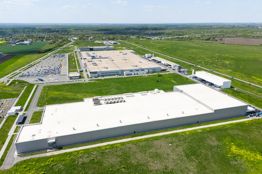 Aerial view of a massive industrial zone with manufacturing plants and warehouses