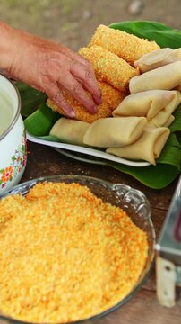 Preparing traditional indonesian risoles with breadcrumbs